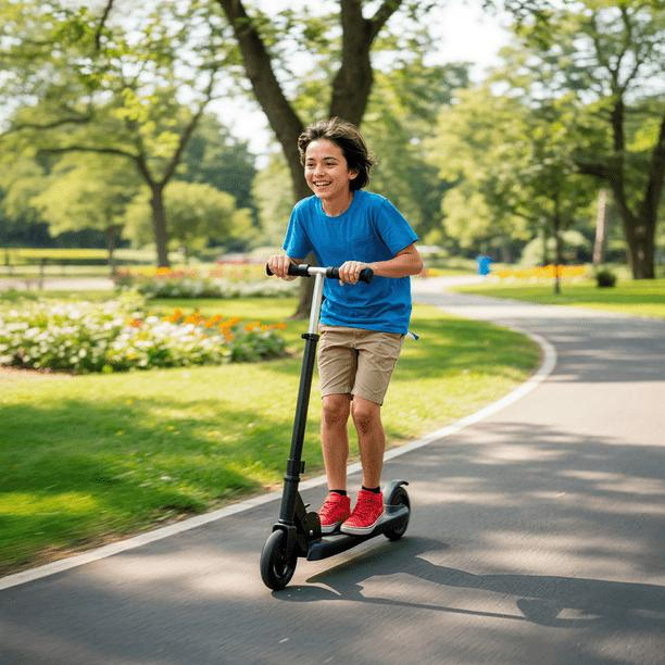 Young person riding an electric kick-scooter in a park